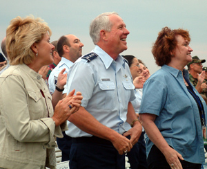 Cathy Gurley (R), national liaison of the tour, enjoys the show with Lt. Gen. William R. Looney III, Commander, Aeronautical Systems Center